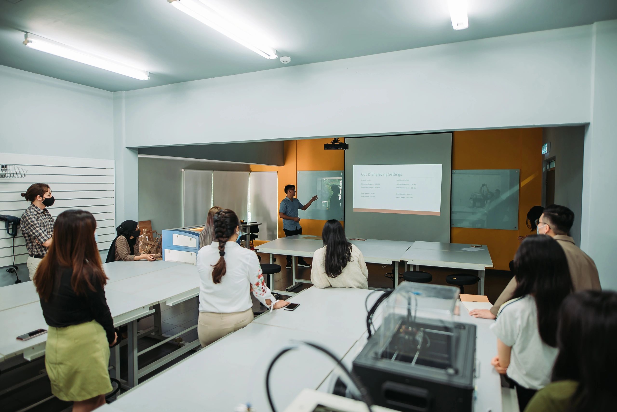 Student presenting in a college classroom