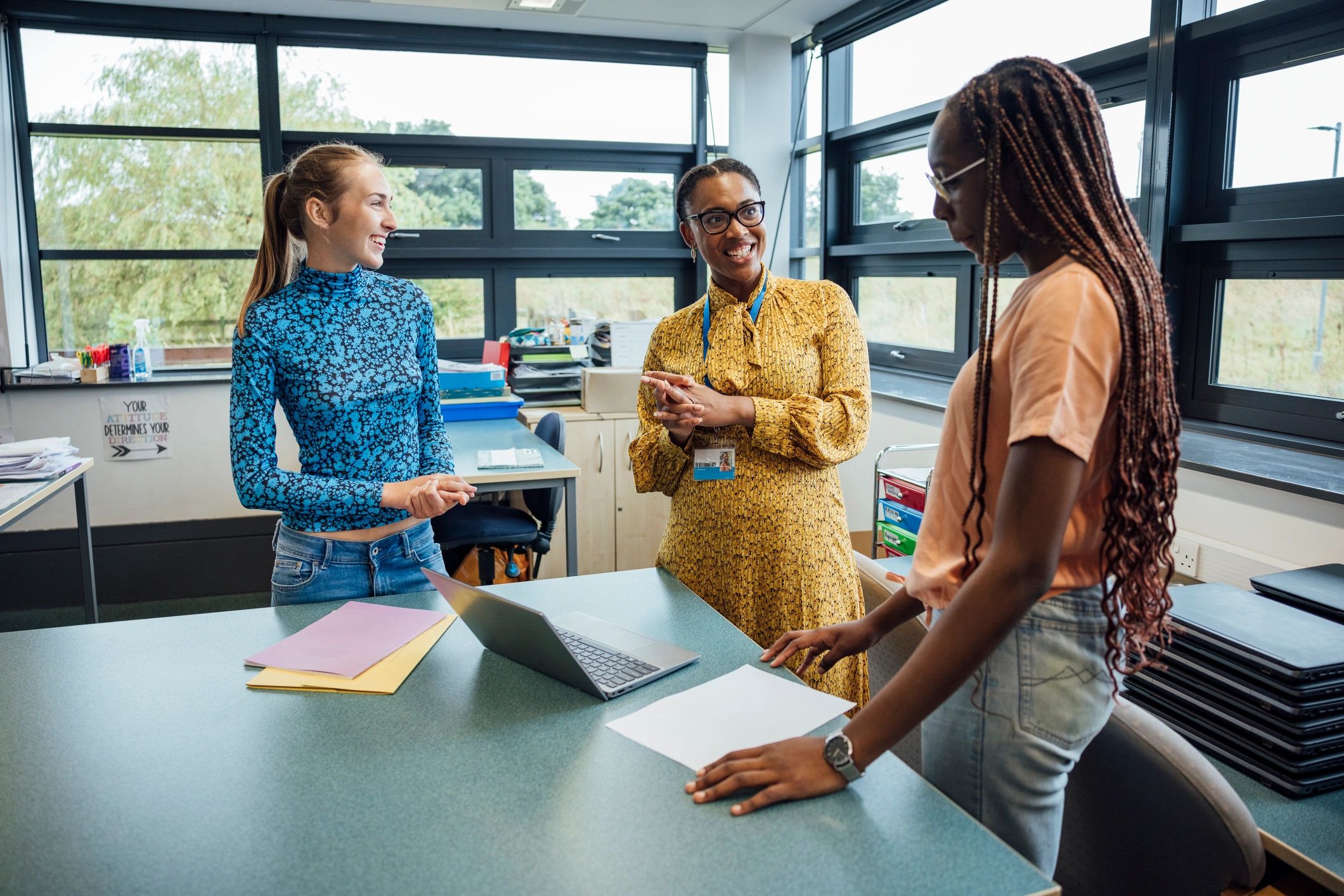 Teacher supporting students during class discussion