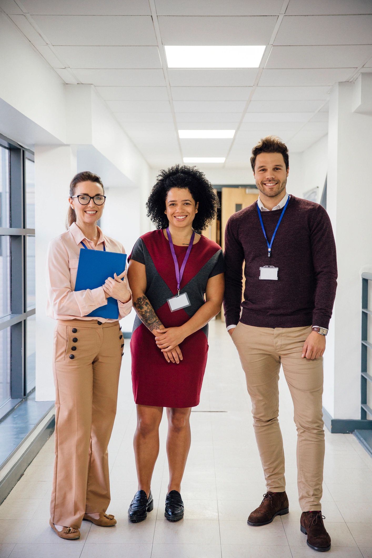 Education team portrait in a school hallway